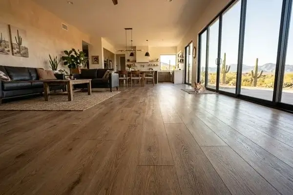 Wide plank luxury vinyl flooring freshly installed in an Arizona living room