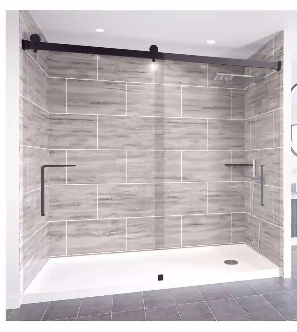 Modern walk-in shower with large-format stone-look tile walls, sliding glass door, and matte black hardware installed by Zona Floors in Arizona