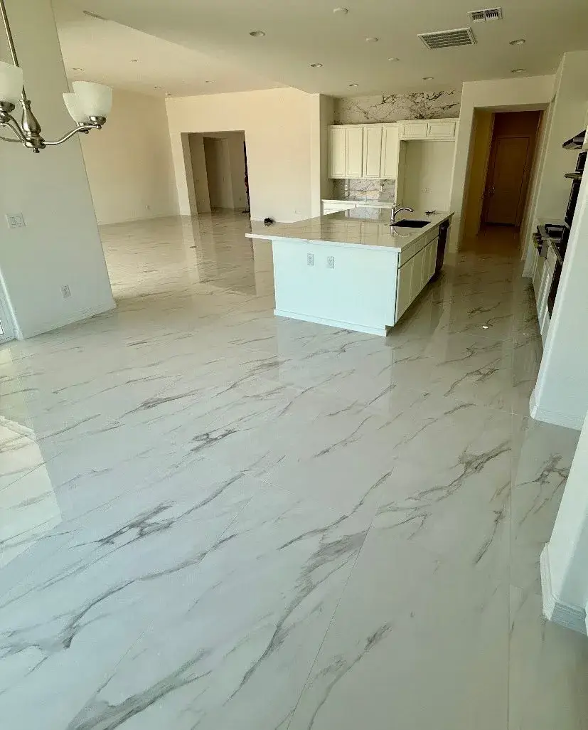Open-concept Arizona kitchen with large-format marble-veined porcelain tile floor installed by Zona Floors